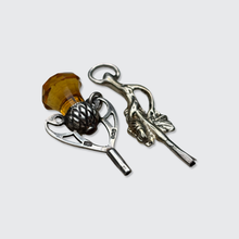 Load image into Gallery viewer, Two Silver Watch Key Pendants, including a Scottish Thistle