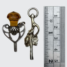 Load image into Gallery viewer, Two Silver Watch Key Pendants, including a Scottish Thistle