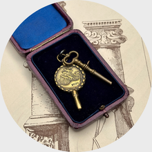 Load image into Gallery viewer, Two Antique Brass Watch Key Pendants